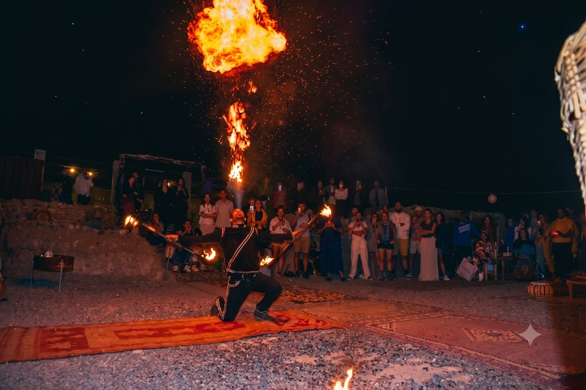 Fire show performer at a Berber dinner spectacle in the Agafay desert at night